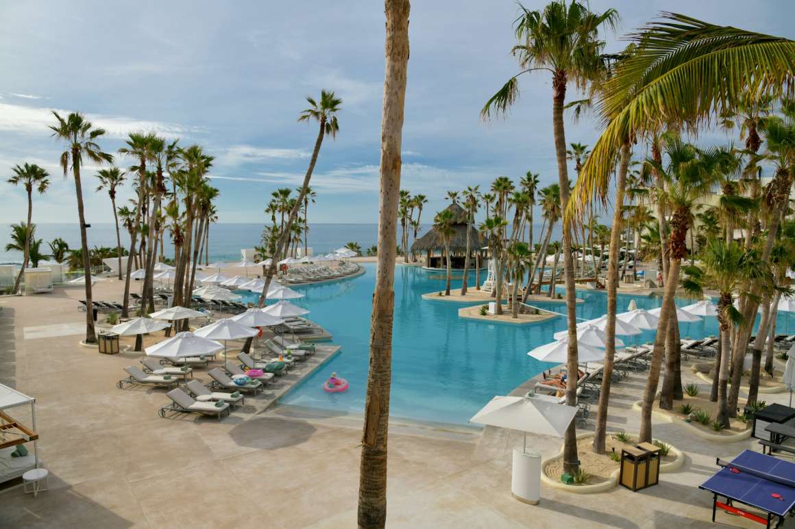 Beachfront resort pool at a property like yours